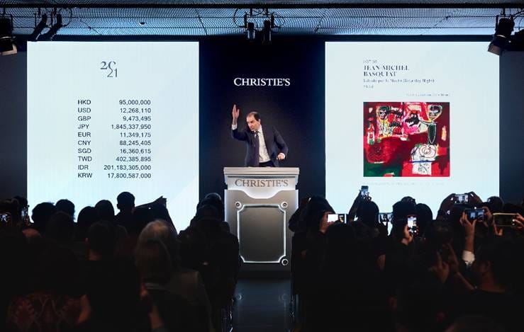Auctioneer Adrien Meyer selling Jean-Michel Basquiat’s Sabado por la Noche (Saturday Night) (HK$112,625,000 / US$14,544,212)  during Christie’s 20th / 21st Century Evening Sale in Hong Kong